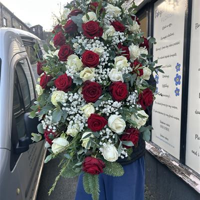 Red and white casket spray 