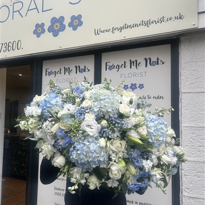 3 foot powder blue and white casket spray 