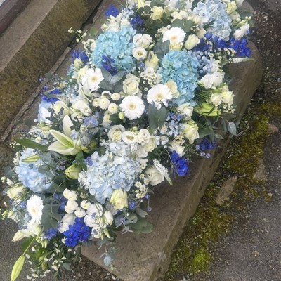 4 foot powder blue and white casket spray 